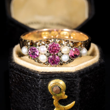 Victorian almandine garnet and seed pearl cluster ring in gold, hallmark-dated 1875, displayed in original antique ring box