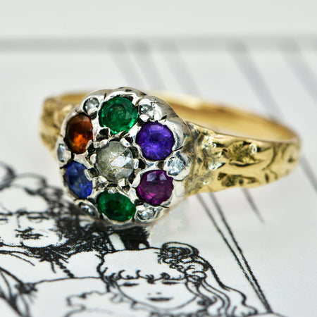 Victorian DEAREST acrostic ring in gold with diamond, emerald, amethyst, ruby, sapphire, and topaz arranged in a cluster setting with rose cut diamond accents, circa 1870