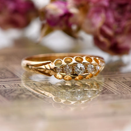 Victorian five-stone diamond ring in 18ct yellow gold, Chester hallmarked 1898, with graduated old mine cut diamonds in carved claw settings
