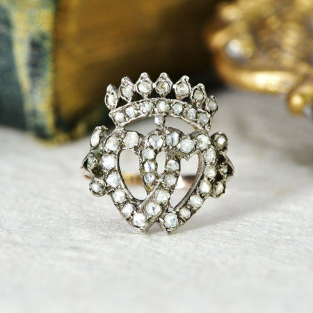 Victorian rose cut diamond Luckenbooth ring in silver and gold, featuring two intertwined hearts beneath a crown, a traditional Scottish design associated with Edinburgh's goldsmiths