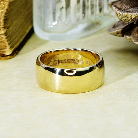 Vintage 9ct gold Sheffield wedding ring showing hallmarks stamped inside the band, including rose town mark, 375 fineness mark, and date letter