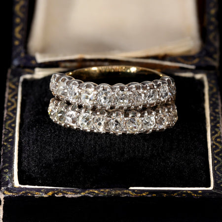 Antique Georgian old mine cut diamond half hoop rings in gold with silver collet settings, displayed in a period leather ring box