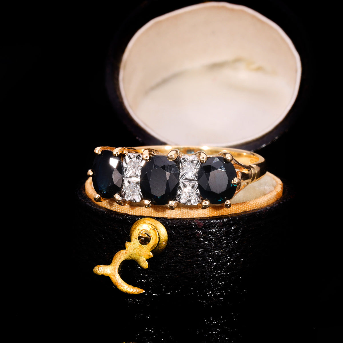 The Vintage 1979 Three Cushion Cut Sapphire And Diamond Ring